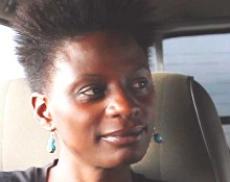 Headshot of Susan Murabana Owen sitting in a car